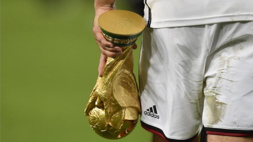 Lukas Podolski in Adidas kit when they last won the World Cup - before German soccer turned to Nike. 