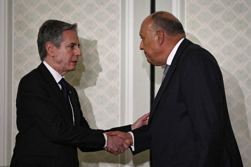 US Secretary of State Antony Blinken (L) and Egypt's Foreign Minister Sameh Shoukry shake hands after giving a joint press conference in Cairo on March, 21, 2024. Blinken said on March 21, a major military operation by Israel in Gaza's southernmost city of Rafah would be "a mistake". (Photo by Khaled DESOUKI / AFP)