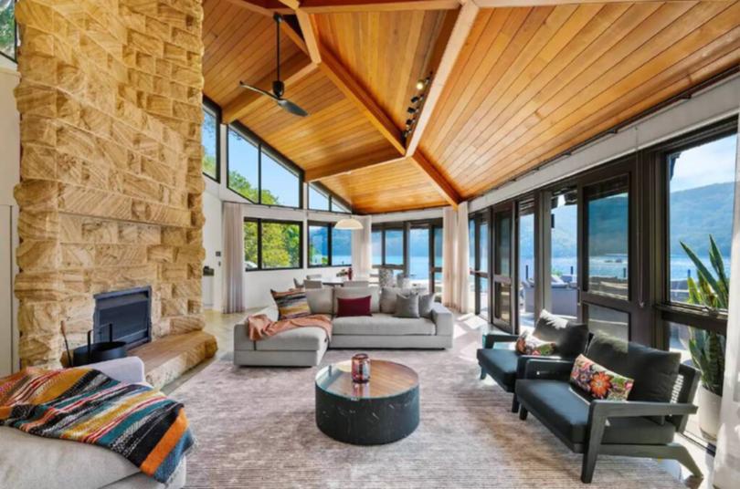 Great views and beautiful interiors, including an impressive sandstone fireplace in the living area make this Cottage Point home a perfect year round retreat.