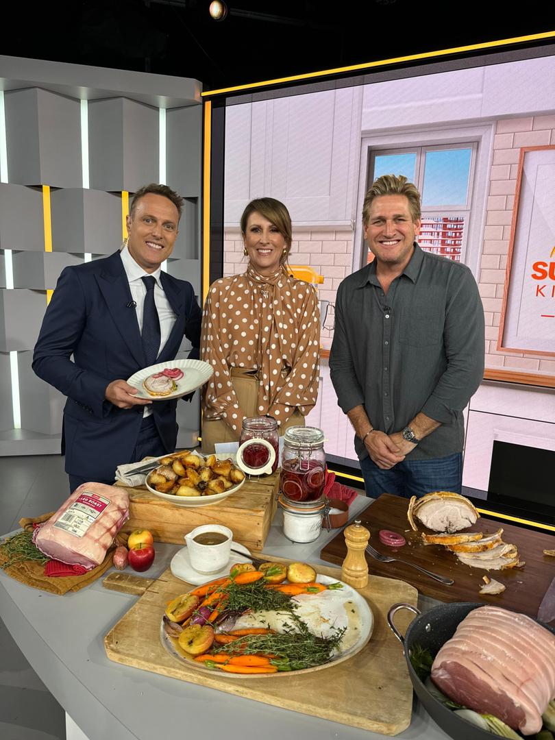 Curtis Stone on Sunrise showing the crew his his pork roast with pickled onions and cider jus recipe.