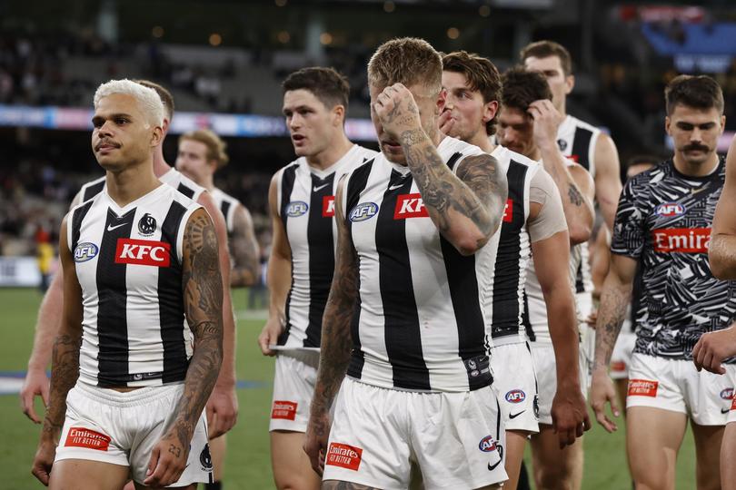 MELBOURNE, AUSTRALIA - MARCH 21: Dejected Magpies players walk from the ground after the round two AFL match between St Kilda Saints and Collingwood Magpies at Melbourne Cricket Ground, on March 21, 2024, in Melbourne, Australia. (Photo by Darrian Traynor/Getty Images)