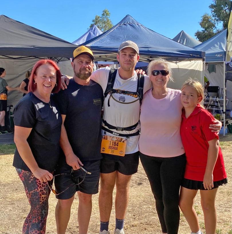 Josh Ferguson (c) with his auntie (l), dad (2nd left), mum (2nd from right) and sister (r). 