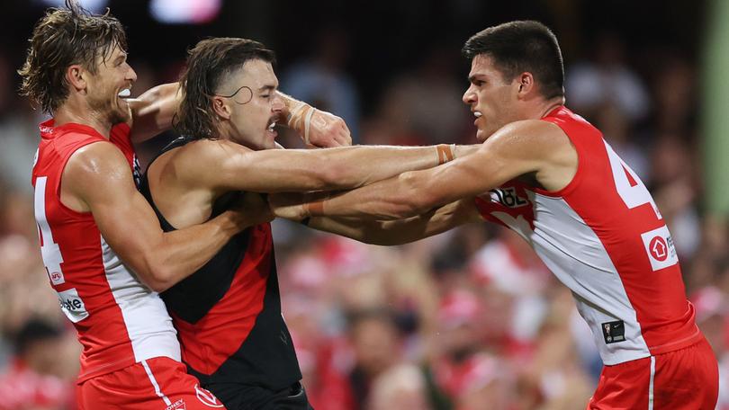 SYDNEY, AUSTRALIA - MARCH 23: Lewis Melican of the Swans and Sam Draper of the Bombers tussle during the round two AFL match between Sydney Swans and Essendon Bombers at SCG, on March 23, 2024, in Sydney, Australia. (Photo by Mark Metcalfe/AFL Photos )