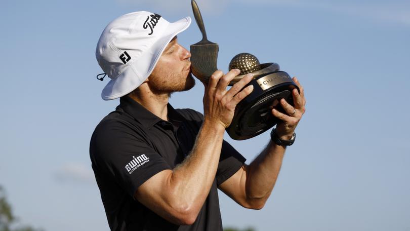 Peter Malnati celebrates winning the Valspar Championship for his first title in nine years.