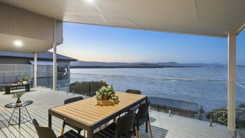 The house is perched on the shores of Lake Illawarra.