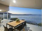 The house is perched on the shores of Lake Illawarra.