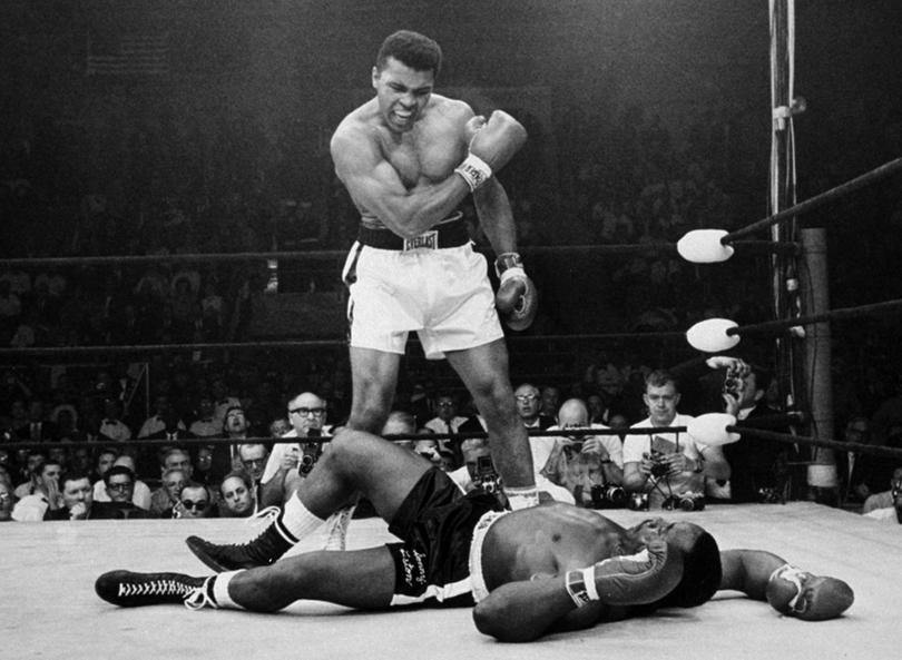 FILE -  In this May 25, 1965, file photo, heavyweight champion Muhammad Ali stands over fallen challenger Sonny Liston, after dropping Liston with a short hard right to the jaw in Lewiston, Maine.  Ali turns 70 on Jan. 17, 2012.(AP Photo/John Rooney, File)