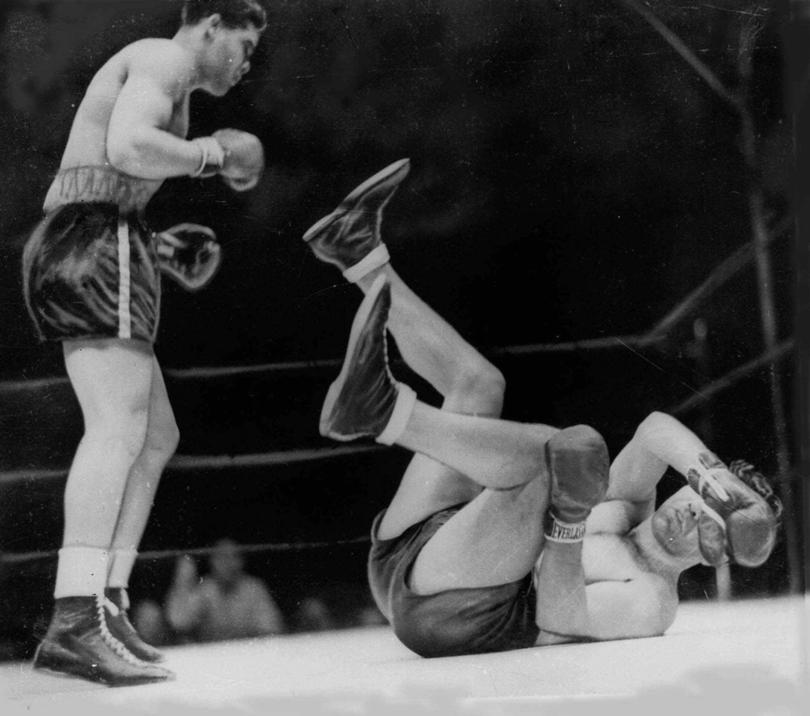 FILE--Boxer Joe Louis, left, knocks out Max Schmeling in the first round to win the heavyweight title, June 22, 1938, at Yankee Stadium in New York. (AP Photo/File)