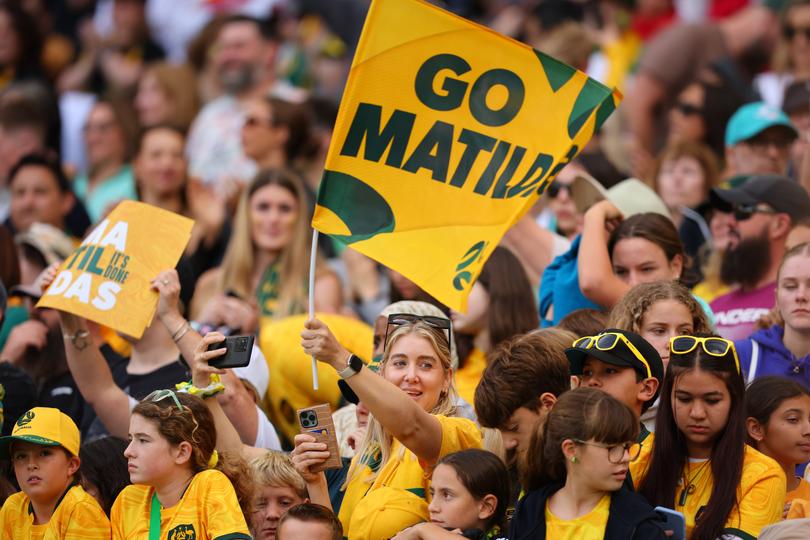 PERTH, AUSTRALIA - OCTOBER 29: Australian Fans celebrate the win during the AFC Women's Asian Olympic Qualifier match between Philippines and Australia Matildas at Optus Stadium on October 29, 2023 in Perth, Australia. (Photo by James Worsfold/Getty Images)