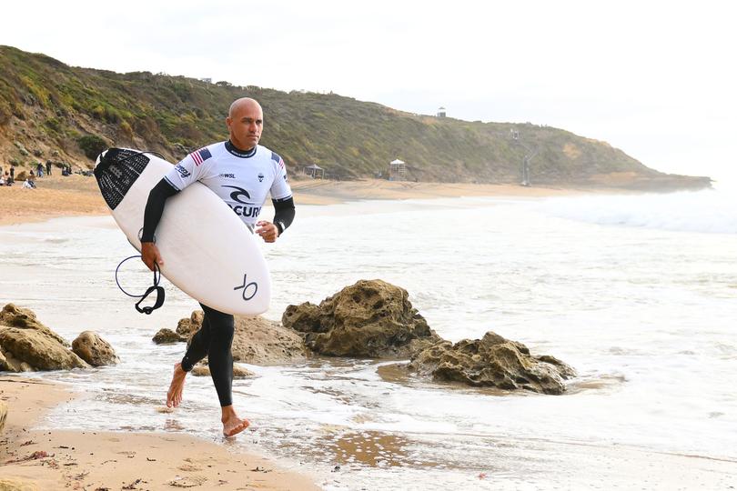 BELLS BEACH, AUSTRALIA - MARCH 26: Kelly Slater of United States prepares to enter the water during the 2024 Rip Curl Pro Bells Beach on March 26, 2024 in Bells Beach, Australia. (Photo by Morgan Hancock/Getty Images)