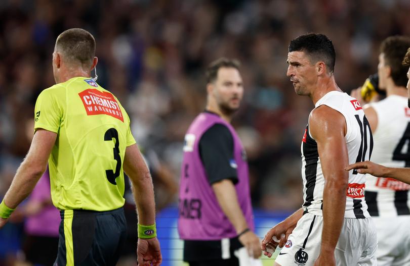 MELBOURNE, AUSTRALIA - MARCH 21: Scott Pendlebury of the Magpies speaks with Umpire Leigh Fisher during the 2024 AFL Round 02 match between the St Kilda Saints and the Collingwood Magpies at the Melbourne Cricket Ground on March 21, 2024 in Melbourne, Australia. (Photo by Michael Willson/AFL Photos via Getty Images)