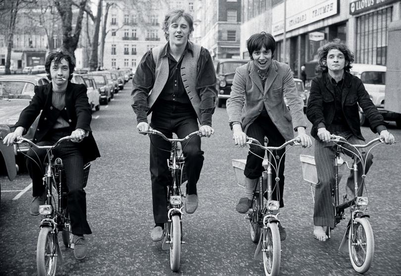Australian pop group The Easybeats ride bicycles around Berkeley Square, London, circa 1968. (Photo by Andrew Maclear/Hulton Archive/Getty Images)