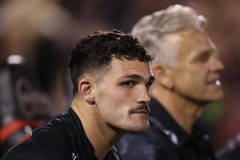 PENRITH, AUSTRALIA - MARCH 21: Nathan Cleary of the Panthers looks on from the bench during the round three NRL match between Penrith Panthers and Brisbane Broncos at BlueBet Stadium on March 21, 2024 in Penrith, Australia. (Photo by Jason McCawley/Getty Images)