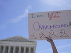 FILE - An abortion-rights activist holds a sign reading "I am not Ovary-Acting," during a protest outside of the U.S. Supreme Court, on June 28, 2022, in Washington. A new poll finds a growing percentage of Americans calling out abortion or womenâ??s rights as priorities for the government in the wake of the Supreme Courtâ??s decision to overturn Roe v. Wade, especially among Democrats and those who support abortion access. (AP Photo/Mariam Zuhaib, File)