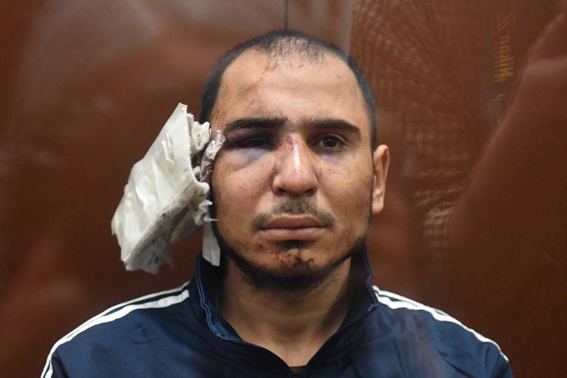 Saidakrami Murodalii Rachabalizoda suspected of taking part in the attack of a concert hall that killed 137 people, the deadliest attack in Europe to have been claimed by the Islamic State jihadist group, sits inside the defendant cage as he waits for his pre-trial detention hearing at the Basmanny District Court in Moscow on March 24, 2024. A Russian court on March 24, 2024 ordered the continued detention of the first suspect in the Moscow concert hall attack that left more than 130 people dead. Moscow's Basmanny district court ordered Dalerdjon Barotovich Mirzoyev, a citizen of Tajikistan, to remain in custody until May 22 pending a terrorism investigation, according to a statement from Moscow city courts on Telegram. (Photo by Olga MALTSEVA / AFP)