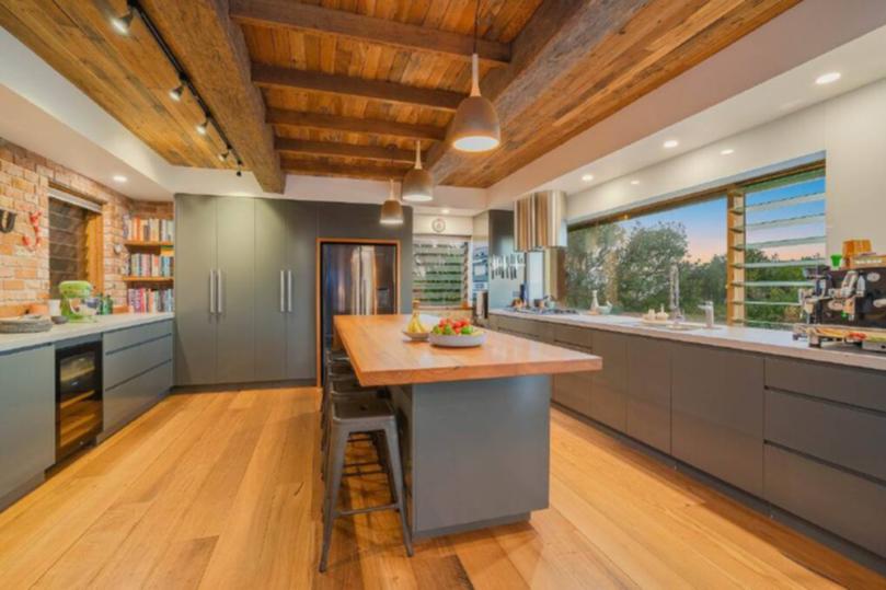 Recycled timber is used on the ceiling and on the benchtops in the kitchen.