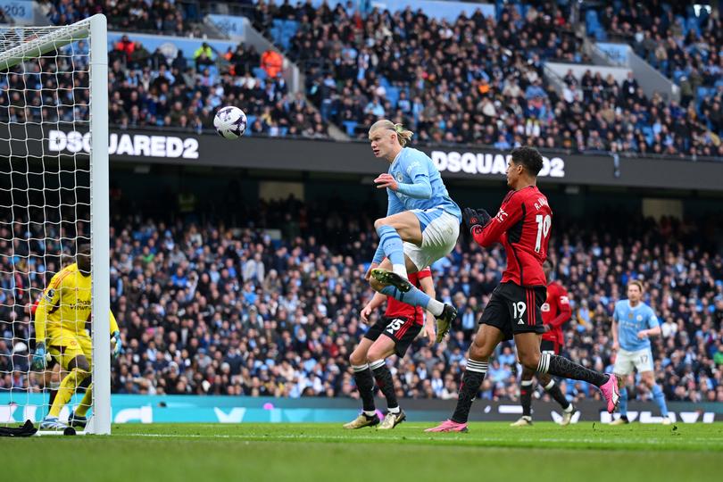 MANCHESTER, ENGLAND - MARCH 03: Erling Haaland of Manchester City misses an opportunity from close range whilst under pressure from Raphael Varane of Manchester United during the Premier League match between Manchester City and Manchester United at Etihad Stadium on March 03, 2024 in Manchester, England. (Photo by Michael Regan/Getty Images)