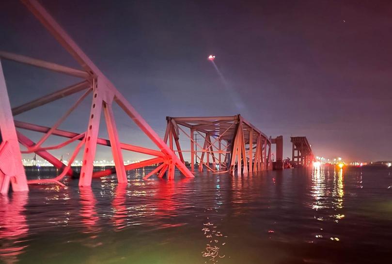 A collapsed section of the Francis Scott Key Bridge after a cargo ship ran into it.