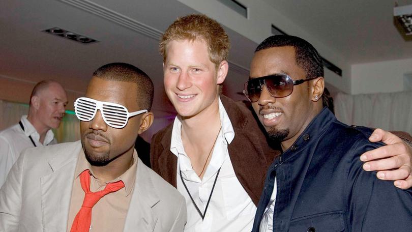 Prince Harry poses for a photograph with Sean ‘Diddy’ Combs and Kanye West at the after party for a concert hosted by Harry and brother Prince William in 2007. 