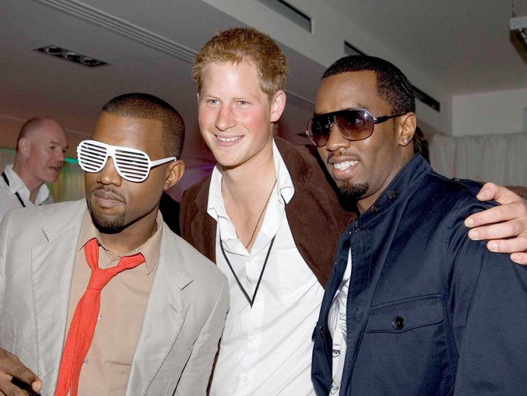 Prince Harry poses for a photograph with Sean ‘Diddy’ Combs and Kanye West at the after party for a concert hosted by Harry and brother Prince William in 2007. 