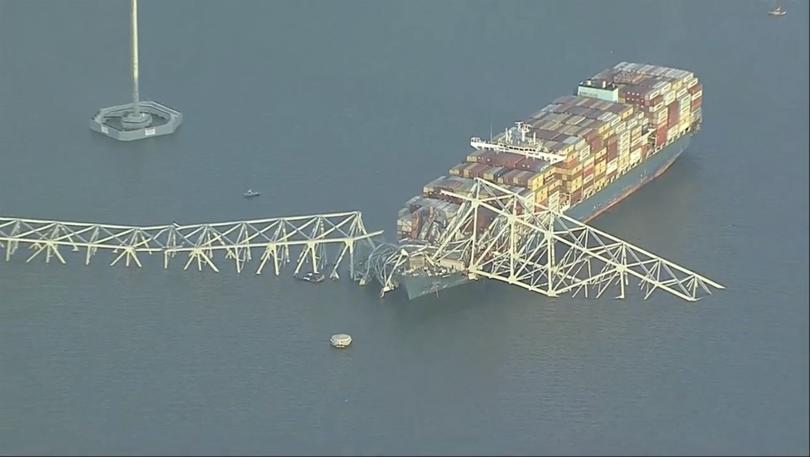 Parts of the Francis Scott Key Bridge remain after a container ship collided with one of the bridge’s supports Tuesday, March 26, 2024 in Baltimore. The major bridge in Baltimore snapped and collapsed after a container ship rammed into it early Tuesday, and several vehicles fell into the river below. Rescuers were searching for multiple people in the water.  (WJLA via AP)