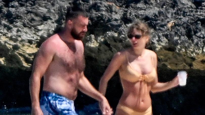 Taylor Swift and Travis Kelce were spotted cooling off in the sea after soaking up the sun on holiday in the Bahamas.