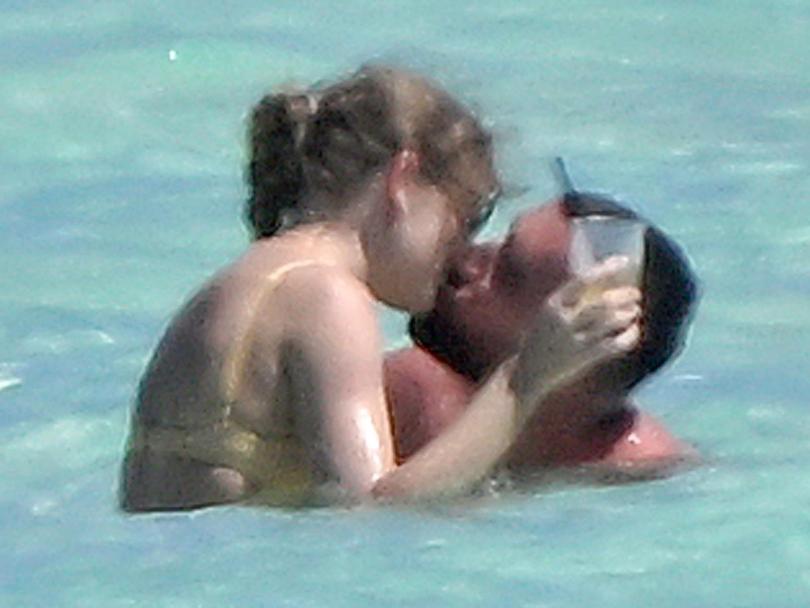 Taylor Swift and Travis Kelce are seen enjoying a very PDA filled day on the beach after a whirlwind year.