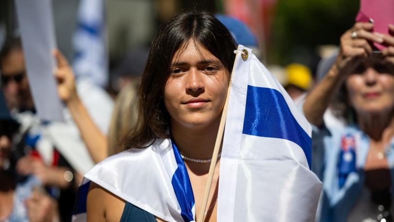 People participate in a rally for solidarity with Israel in Sydney.