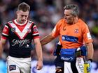 Sam Walker is helped from the field after being injured in the match against the Rabbitohs. (Dan Himbrechts/AAP PHOTOS)