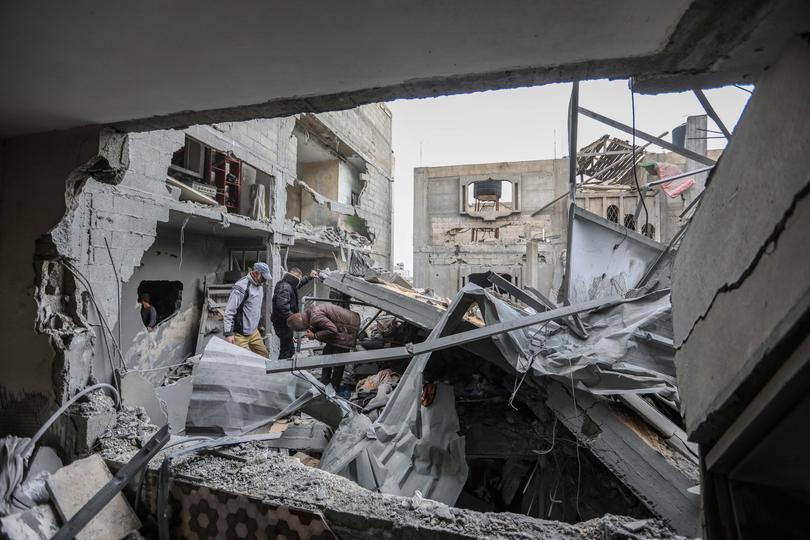 RAFAH, GAZA - MARCH 24: People inspect damage and recover items from their homes following Israeli air strikes on March 24, 2024 in Rafah, Gaza. Despite warnings from US President Biden, Israeli forces have targeted the city of Rafah which is currently home to an estimated million Palestinian refugees. According to Gaza's Ministry of Health, more than 31,000 Palestinians have been killed, and over 73,000 wounded in Israel's ongoing bombardment of Gaza starting on October 7. (Photo by Ahmad Hasaballah/Getty Images)