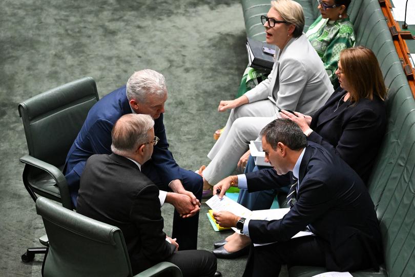 Australian Prime Minister Anthony Albanese, Australian Treasurer Jim Chalmers and Australian Employment Minister Tony Burke speak during Question Time in the House of Representatives at Parliament House in Canberra, Wednesday, November 15, 2023. (AAP Image/Lukas Coch) NO ARCHIVING