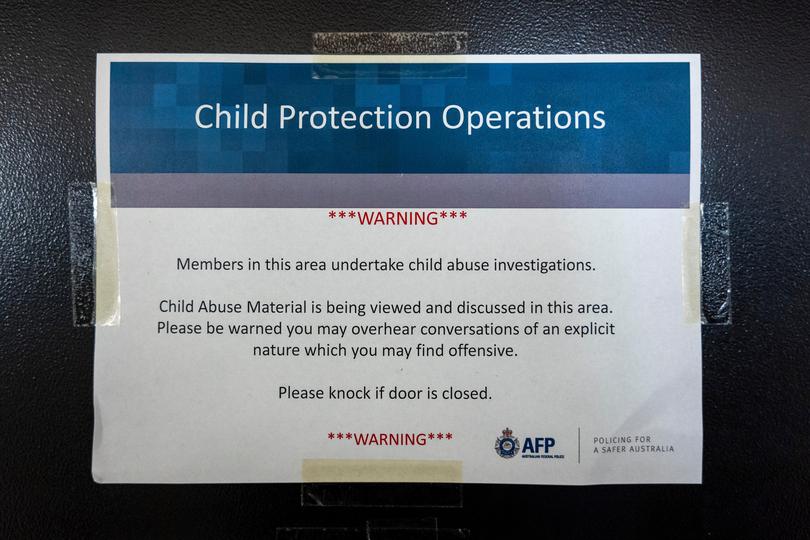 A warning sign posted on the Child Protection Operations unit’s door in Canberra. 