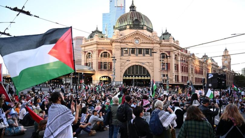 Protesters closed down Melbourne's Flinders Street intersection. 