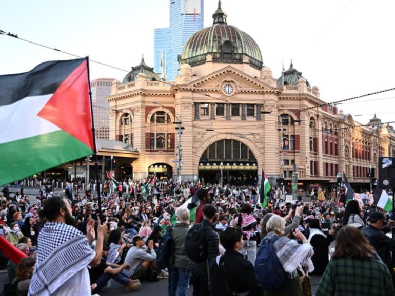 Protesters closed down Melbourne's Flinders Street intersection. 