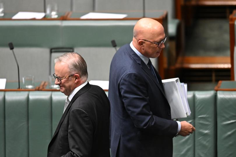 Australian Prime Minister Anthony Albanese walks past Australian Opposition Leader Peter Dutton during Question Time in the House of Representatives at Parliament House in Canberra, Thursday, February 8, 2024. (AAP Image/Lukas Coch) NO ARCHIVING