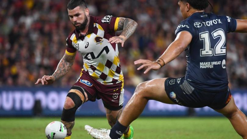 Adam Reynolds grubbers a ball past the Cowboys' defence.