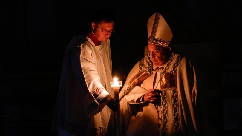 Pope Francis has blessed an Easter candle, the flame of which was then shared with other candles.