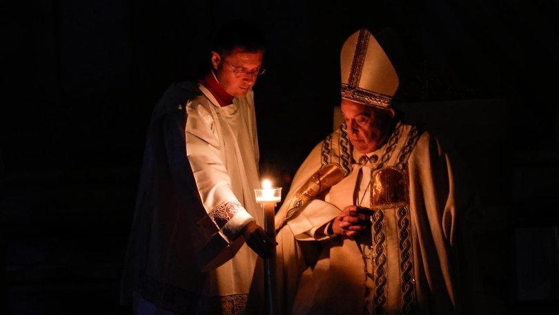 Pope Francis has blessed an Easter candle, the flame of which was then shared with other candles. 