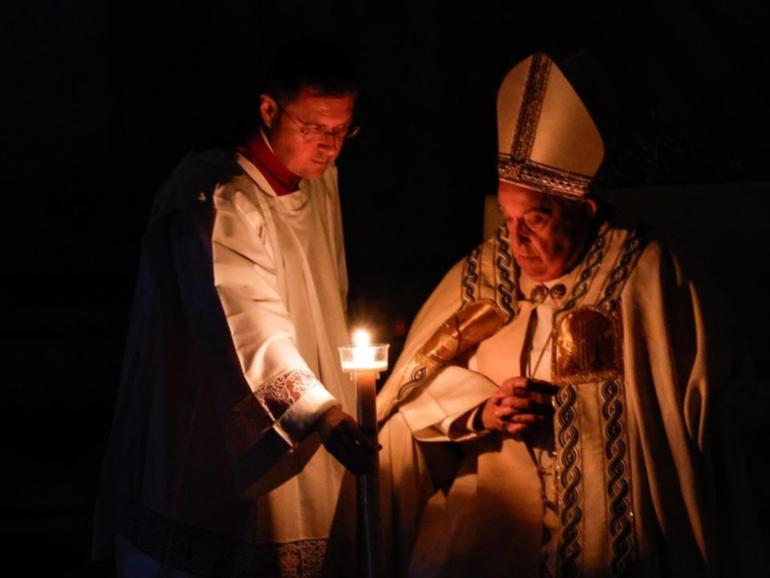 Pope Francis has blessed an Easter candle, the flame of which was then shared with other candles. 