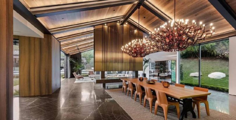 The formal dining room, with custom-made chandeliers.