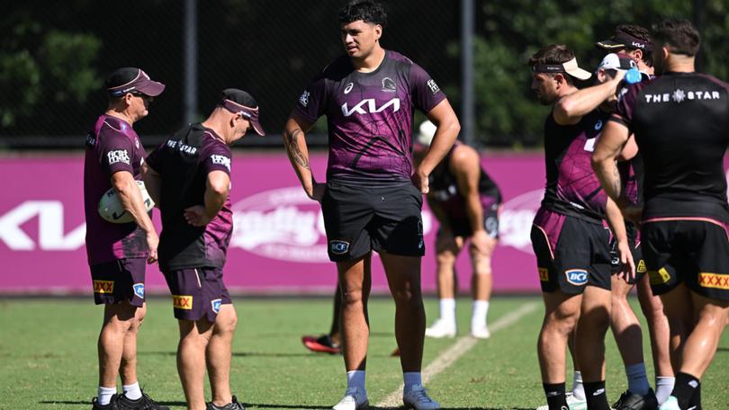 Broncos assistant coach Allan Langer (2nd from left) and Coach Kevin Walters (left) talk with Benjamin Te Kura (centre) during an NRL Brisbane Broncos training session in Brisbane on Wednesday.