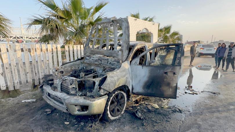 One of the damaged vehicles after the Israeli attack in Deir al-Balah, Gaza.