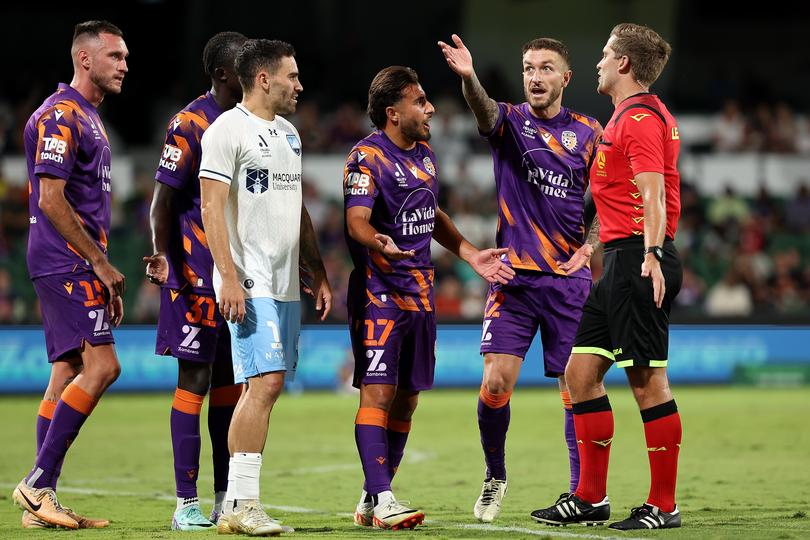 PERTH, AUSTRALIA - APRIL 03: Jarrod Carluccio and Adam Taggart of the Glory plead with Referee Alex King for the VAR during the A-League Men round 12 match between Perth Glory and Sydney FC at HBF Park, on April 03, 2024, in Perth, Australia. (Photo by Paul Kane/Getty Images)