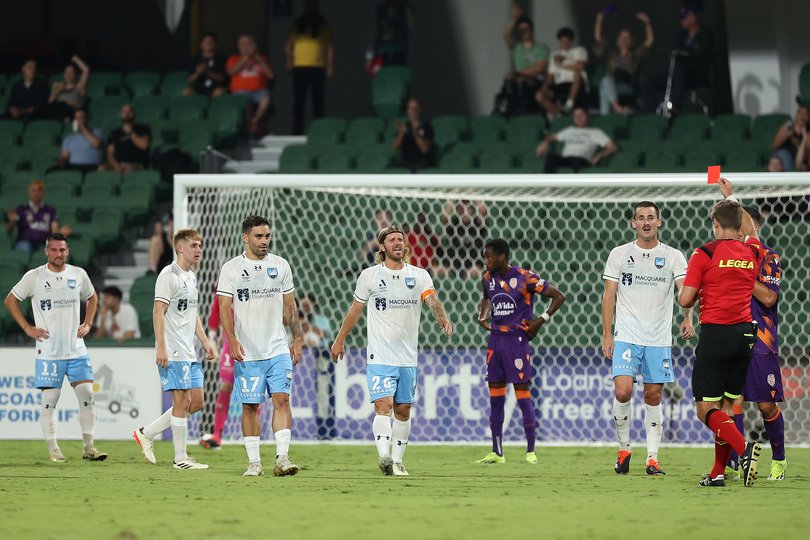 PERTH, AUSTRALIA - APRIL 03: Referee Alex King shows the red card to Jake Girdwood-Reich of Sydney during the A-League Men round 12 match between Perth Glory and Sydney FC at HBF Park, on April 03, 2024, in Perth, Australia. (Photo by Paul Kane/Getty Images)