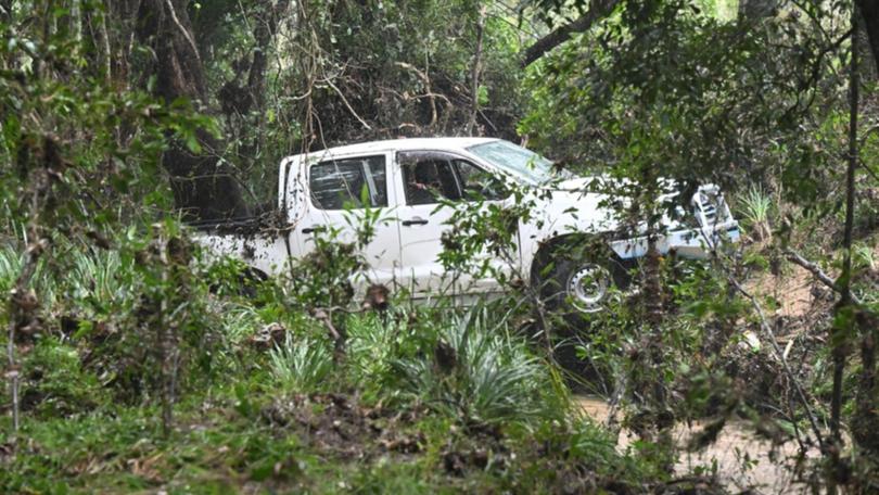 The body of a man was found near his ute in floodwaters at Greenbank, Queensland. (Darren England/AAP PHOTOS)