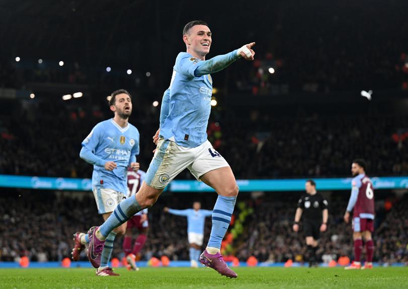 MANCHESTER, ENGLAND - APRIL 03: Phil Foden of Manchester City celebrates scoring his team's third goal during the Premier League match between Manchester City and Aston Villa at Etihad Stadium on April 03, 2024 in Manchester, England. (Photo by Michael Regan/Getty Images)