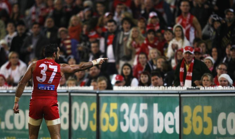 Adam Goodes points into the crowd alerting security to comments made during the 2013 AFL round 09 match between the Collingwood Magpies and the Sydney Swans at the MCG, Melbourne on May 24, 2013. (Photo: Andrew White/AFL Media)