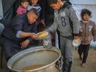 Children queue for food in Rafah.