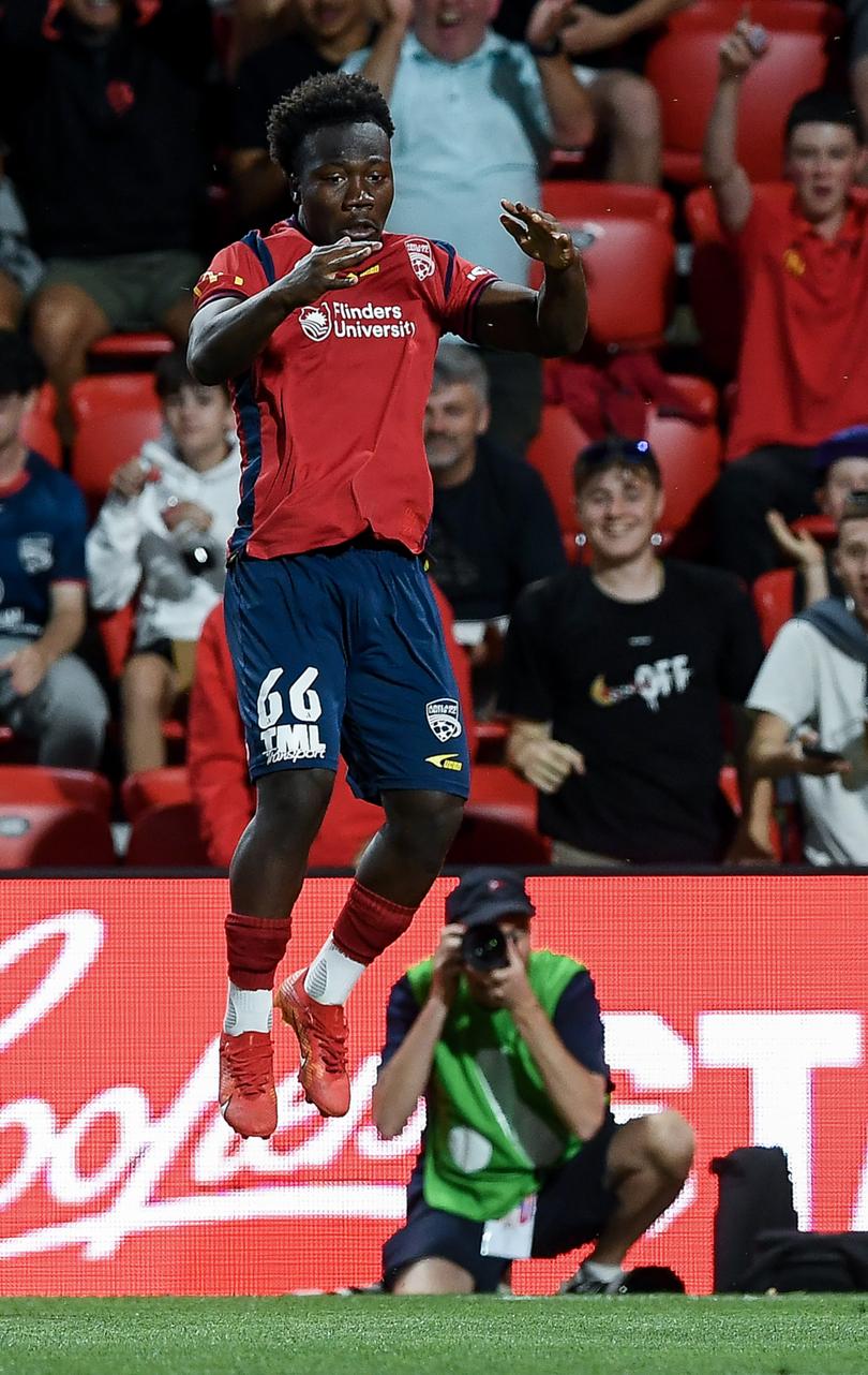 ADELAIDE, AUSTRALIA - MARCH 29:  Nestory Irankunda of Adelaide United performs a backflip after scoring his teams second goal during the A-League Mens round 22 match between Adelaide United and Western United at Coopers Stadium, on March 29, 2024, in Adelaide, Australia. (Photo by Mark Brake/Getty Images)