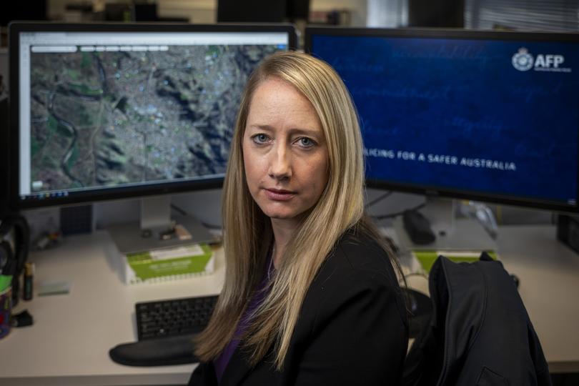 FOR THE NIGHTLY - 20240402: Kirsty Clarke, 37, is a member of the Victims Identification Unit in the Australian Federal Police, based in Canberra. Kirsty reviews visual material of child exploitation to identify victims of sexual abuse. Photo made in the office of the victims identification unit at the AFP.  Story by Kristin Shorten. Photo by Sean Davey.